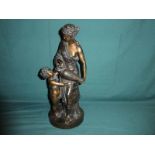 A good cast Bronze figure of a Female Water Carrier with a Young Boy drinking from her Amphora, on