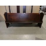 A pitch pine Church Pew of typical plain form, three panel back, solid ends, no kneeler, 210cm