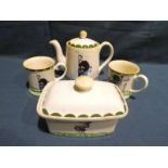 Four items of Carlton Ware Gollywogg Company Tableware, Trial Teapot, two Beakers and lidded sample