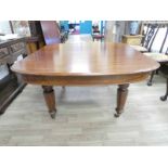 A Victorian mahogany extending Dining table, rounded rectangular form with moulded edge, single