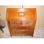 A Chinese style hardwood Fall Front Bureau, typical form with fitted interior, circular device to