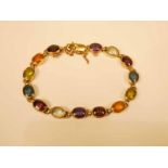 A 9ct gold 14 stone rub over set cabochon semi precious stone bracelet 18.5cm, 17.4g