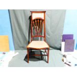 An early 20th century mahogany Parlour Chair, curved top rail, upholstered and radiating spar