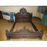 A good reproduction King size hardwood Bed Stead. The headboard featuring Lion and Unicorn Dieu et