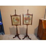 A pair of Victorian mahogany Pole Screens, woolwork tapestry panels in rectangular glazed frames,