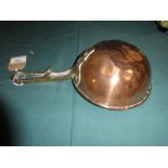 A 19th century copper Ladle, 20cm diameter with cast brass handle