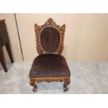 A Victorian mahogany show frame Parlour Chair, carved scrolling foliate back rail, twist side