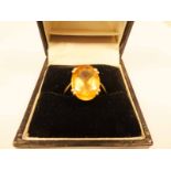 A 9ct gold oval cut dress ring, the stone 13mm X 10mm, size O 1/2, 3.3g