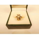 An 18ct diamond star cluster ring set with graduated stones, size P, 4.8g