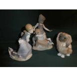 Three Lladro porcelain Figural Models: Boy and Girl with a Goose, 26cm high, Girl with a Dog pulling