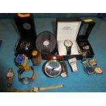 14 Ladies and Gents modern wrist watches and a bedside alarm clock