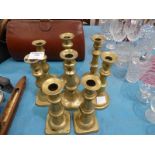 Eight Brass Candlesticks