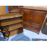 An open Bookcase and a Media Cabinet