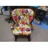 An Ercol type Spindle back Rocking Chair, upholstered similar to previous lot