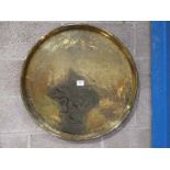 A large Indian brass circular Wall Plaque with embossed decoration and raised edge 68cm diameter