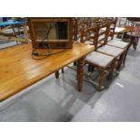 A pine Farmhouse Dining Table and 6 ladderback Chairs
