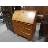 A 1970s teak Fall Front Bureau above 3 drawers