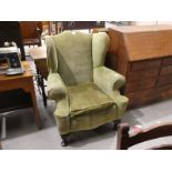 A 1930s Georgian style wingback Armchair in green velour