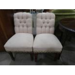 A pair of Victorian button back Chairs with stuff over seats