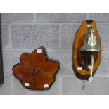 A polished tree trunk slice Wall Clock and a Repro Brass Dover Bell on a trunk slice