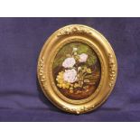 A small oval framed oil on board Still Life of Flowers and Grapes on a Mossy Bank, signed George