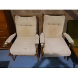 A pair of teak frame Easy Chairs