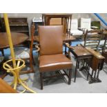 A late Georgian Gentlemans Elbow Chair in brown leather upholstery