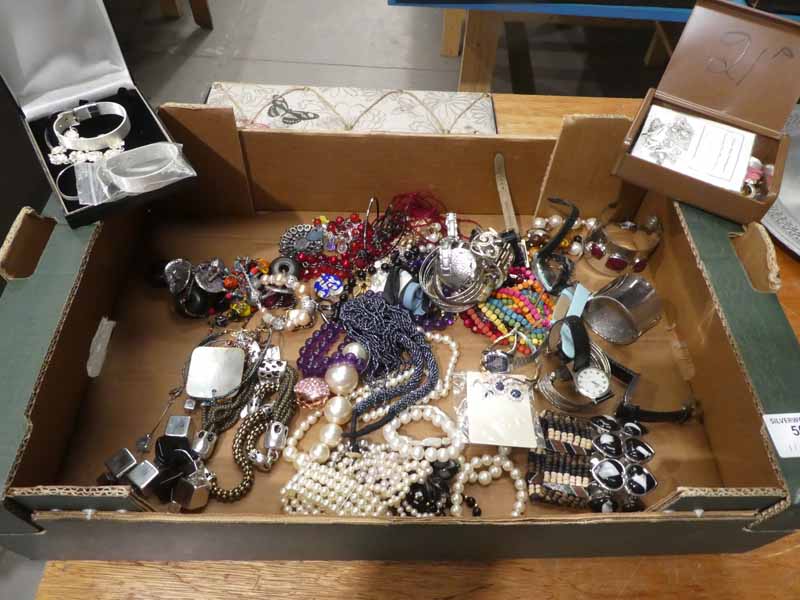 A collection of mixed costume beads, bangles, fashion watches and other jewellery