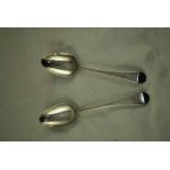 A matched pair of George III hallmarked silver Serving Spoons, one London 1788 by George Smith &