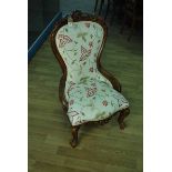 A Victorian mahogany show frame lady's Parlour Chair, carved cresting rail, apron and cabriole front