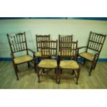 A set of six stained beech rush seat Yorkshire dining chairs on turned legs to pad feet