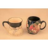 A Moorcroft Pottery mug of waisted form in a rare polar bear pattern signed Kerri to the base (