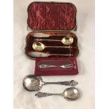 A matching 800 grade silver soup spoon, desert spoon and cake fork with pierced rococo handles,