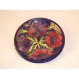 A Morocroft Pottery charger or plate in the Anenome pattern, 26 cm dia. unboxed