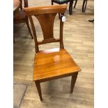 A set of eight late 20th century walnut Dining Chairs, scroll edge bar back, central vase shape