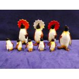 Beswick pottery a group of nine Penguins, three with Umbrellas, one other and five small examples