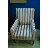 An Edwardian armchair in pink velour neo-classical striped upholstery on square tapering legs
