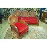 A 1930s walnut veneered bentwood bergére suite including a three seat sofa and single chair with