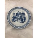 A small 19th century Chinese porcelain saucer, decorated in underglaze blue with scenes of