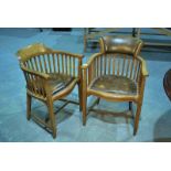 A set of 12 1930s oak boardroom chairs with flared backs on lathe supports over padded seats and