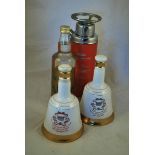 A novelty Fire Extinguisher Bottle of Echter Sprockhoveler 70cl and two 50cl Bells Decanters
