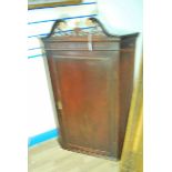 Corner cupboard with broken swan neck pediment, mahogany