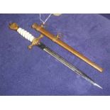 A German Third Reich Kriegsmarine officer's Dagger, by WKC, white celluloid wired grip with gilt