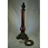 An Edwardian ruby glass and ormolu Table Lamp with bulbous column