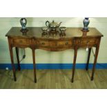 An early 20th century mahogany Sheraton revival three drawer Sideboard on fine square tapering