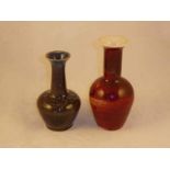 A Cobridge sprinkler vase with everted rim, in flambe glaze 18 cm H; together with a smaller example