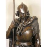 A c1930 hollowcast bronze Figural Floor Lamp modelled as a Teutonic warrior in mail and plate