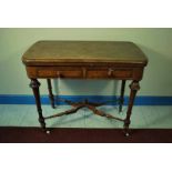 An aesthetics period walnut folding games or card table with two quadrant lined frieze drawers and