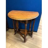 Small oak drop leaf table with pierced end supports and turned swing legs, Liberty of London label