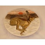 A Cobridge 2000 Year plate, decorated with a running hare in frosty winter landscape with sunset